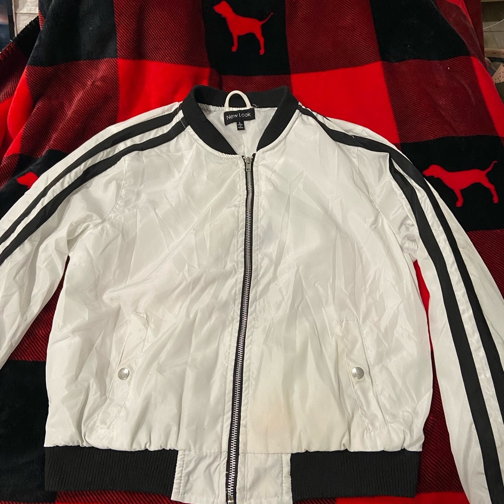White and black zip up.